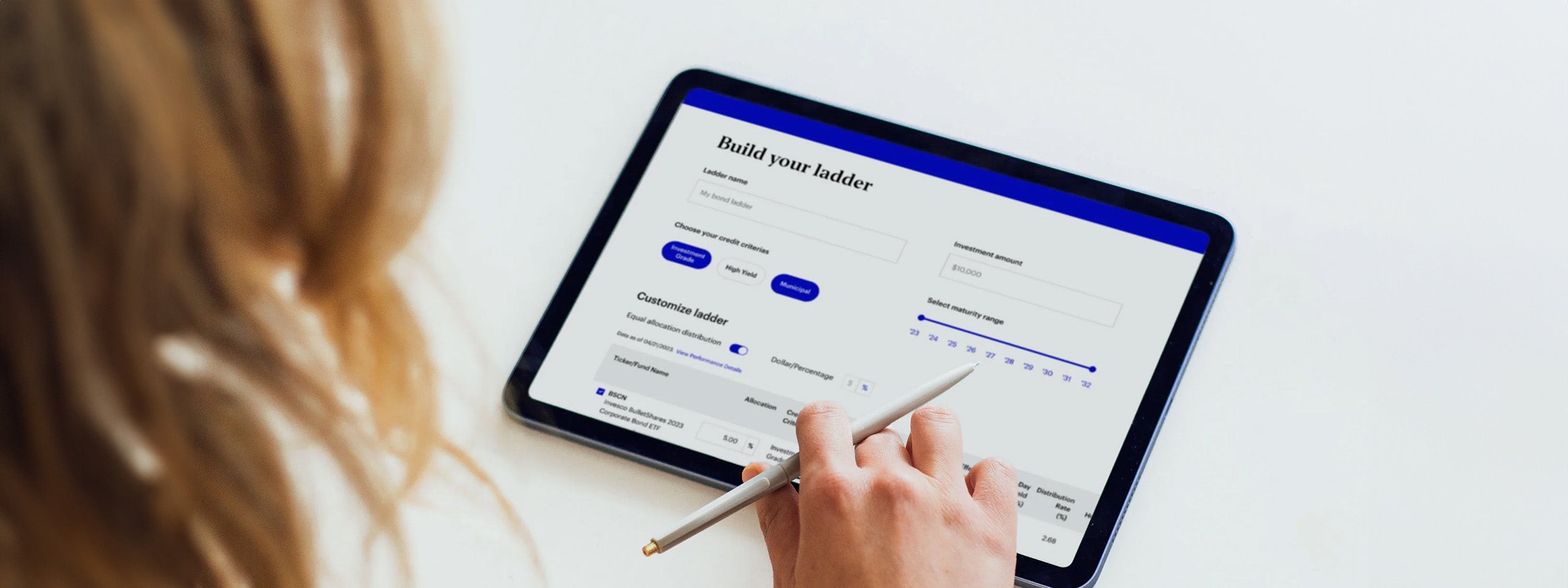 person writting on a tablet