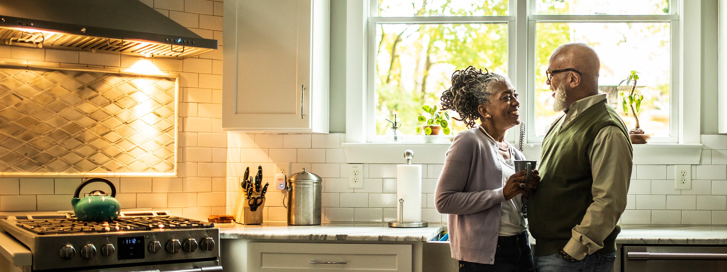Couple standing in kitchen