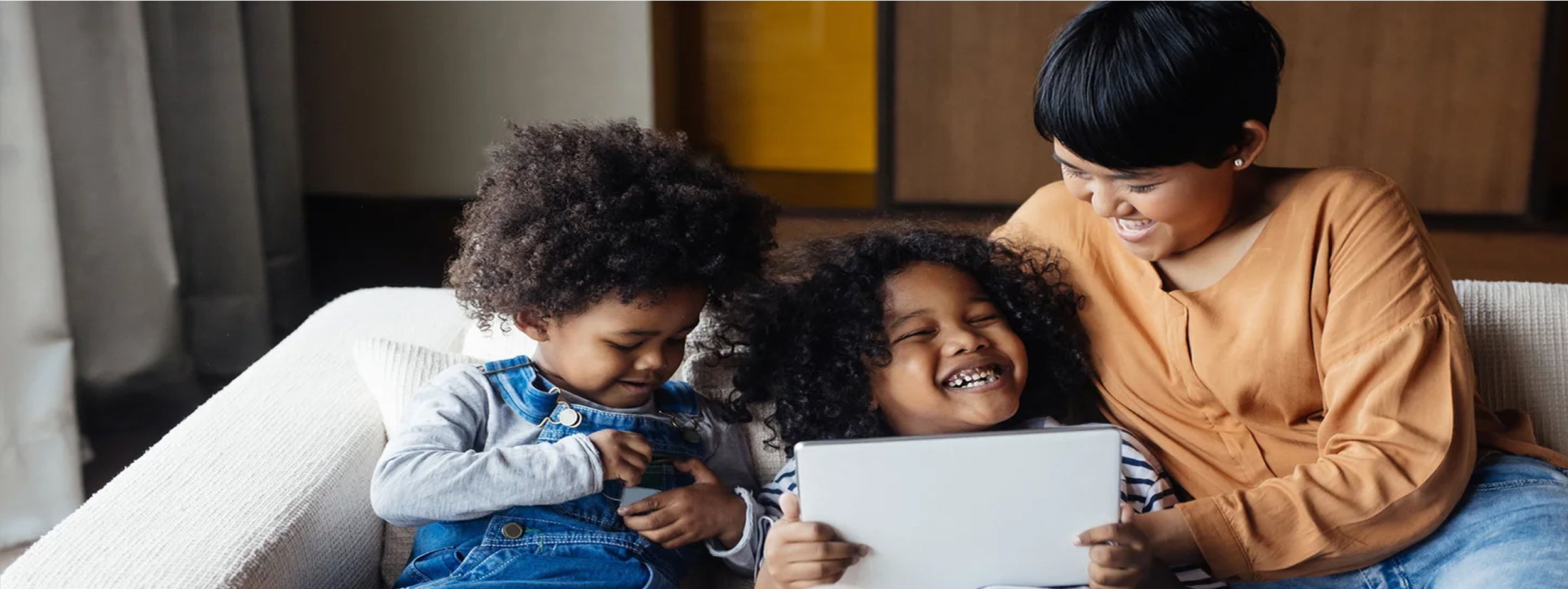 A mother and children on the couch