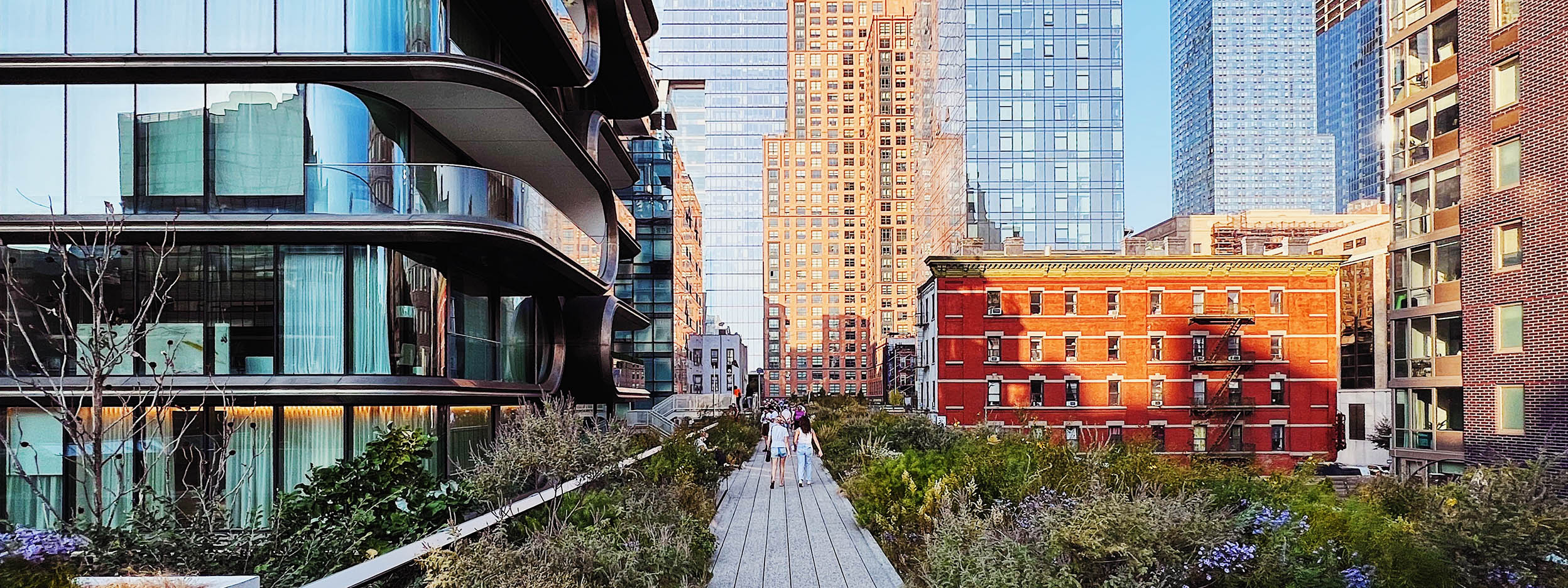 Sidewalk through a city of buildings