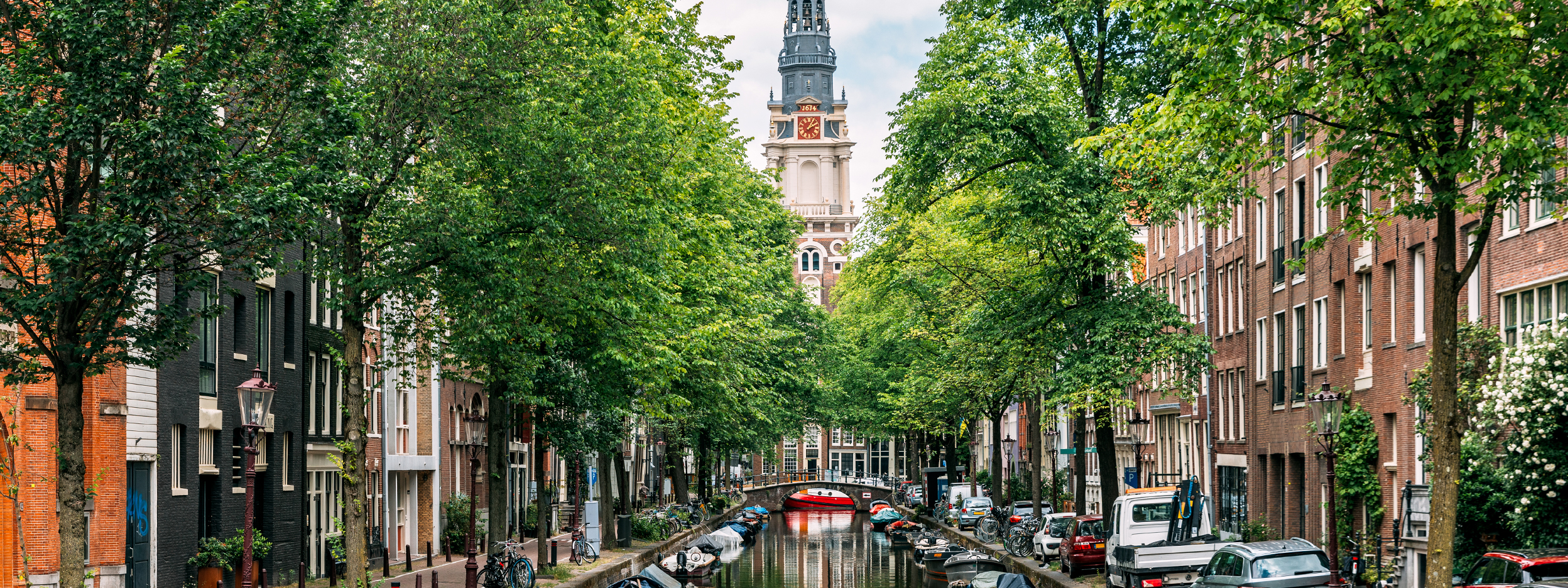  Zuiderkerk church and Groenburgwal canal in summer, Amsterdam, Netherlands