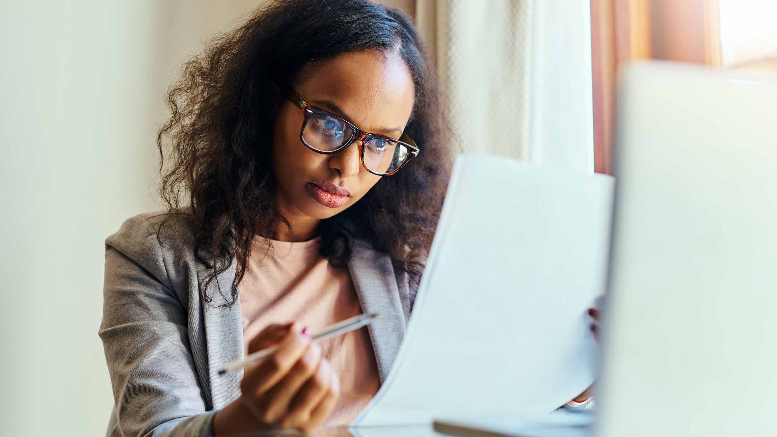 Business woman looking at paperwork