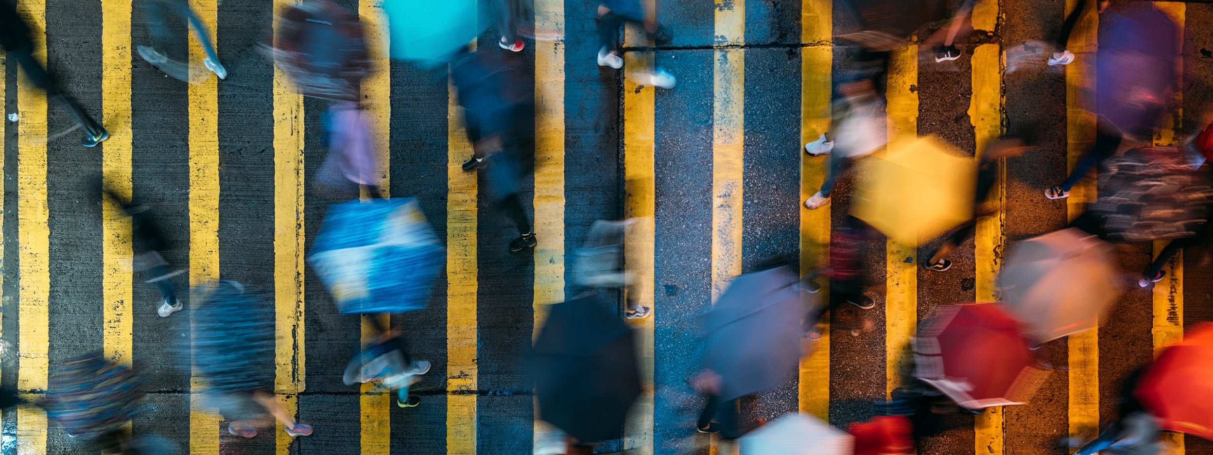 Aerial view of people walking in the rain