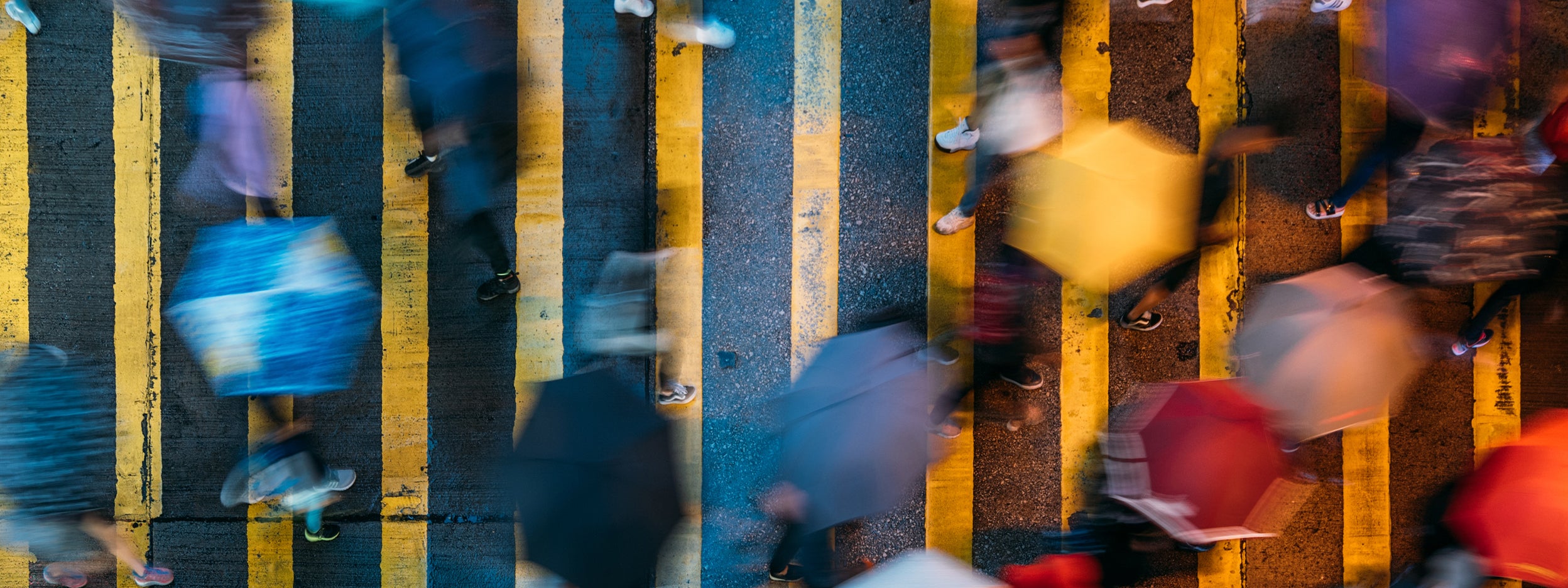 Aerial view of people walking in the rain