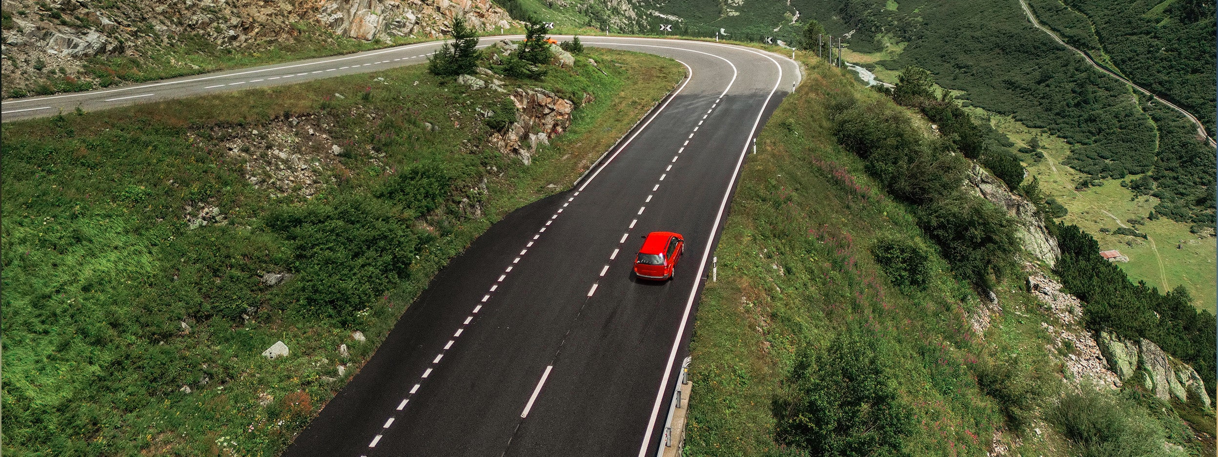 Car driving on winding road