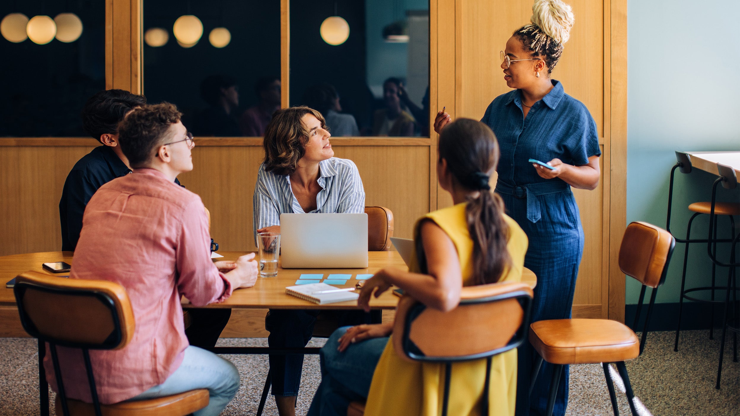 Team meeting around a table in a modern office