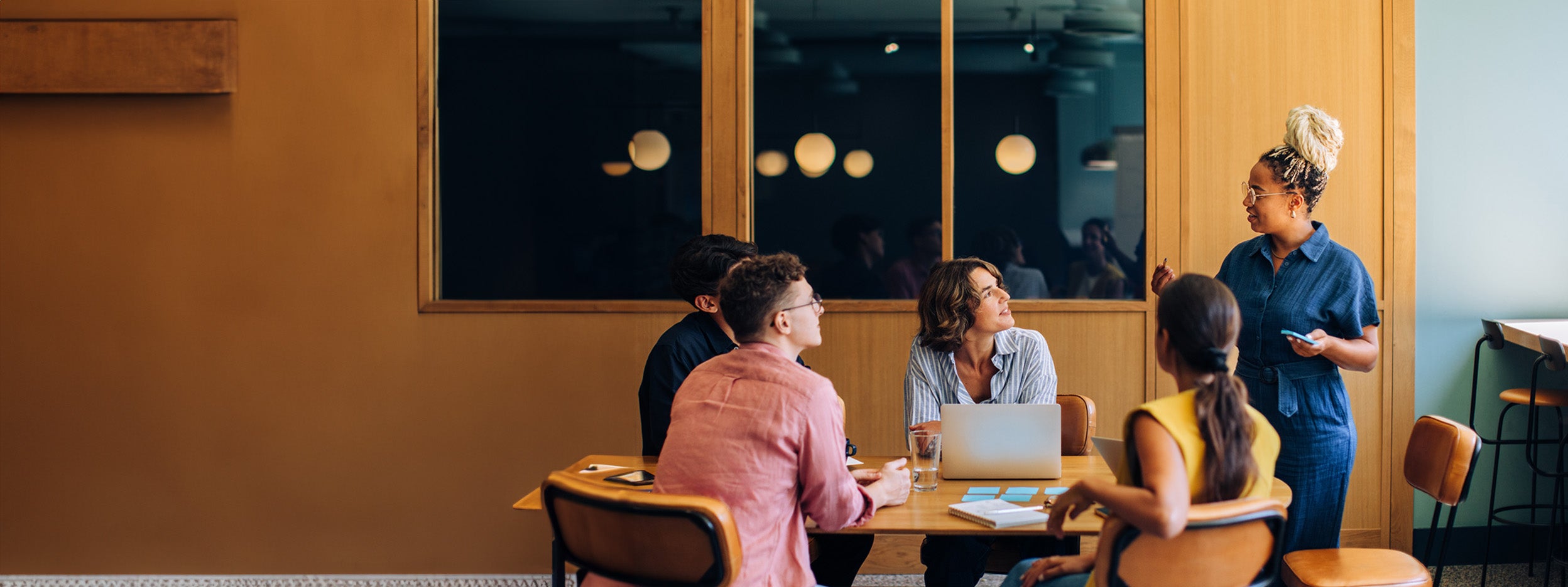 Team meeting around a table in a modern office