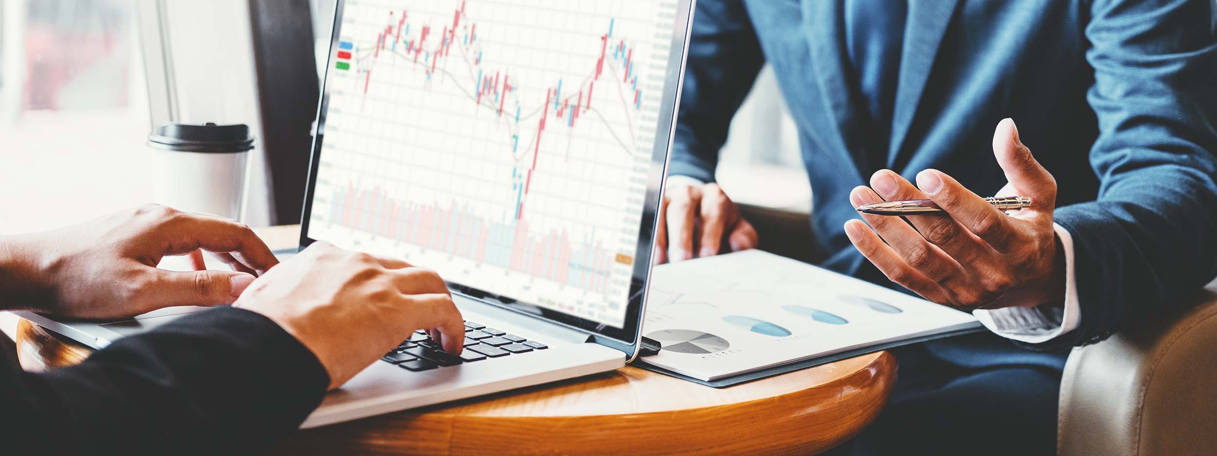 Man checking stock performance on laptop