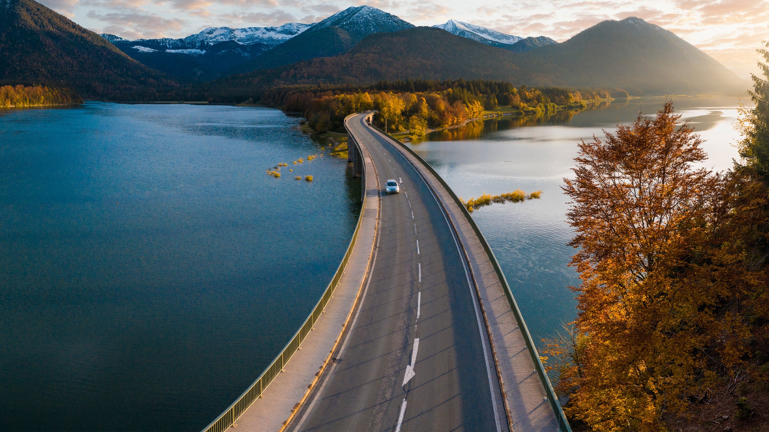 Aerial view of a road beside a lake
