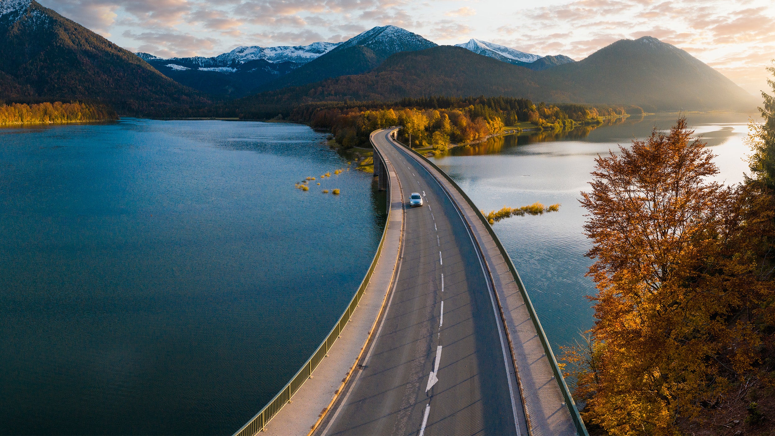 Aerial view of a road and lake