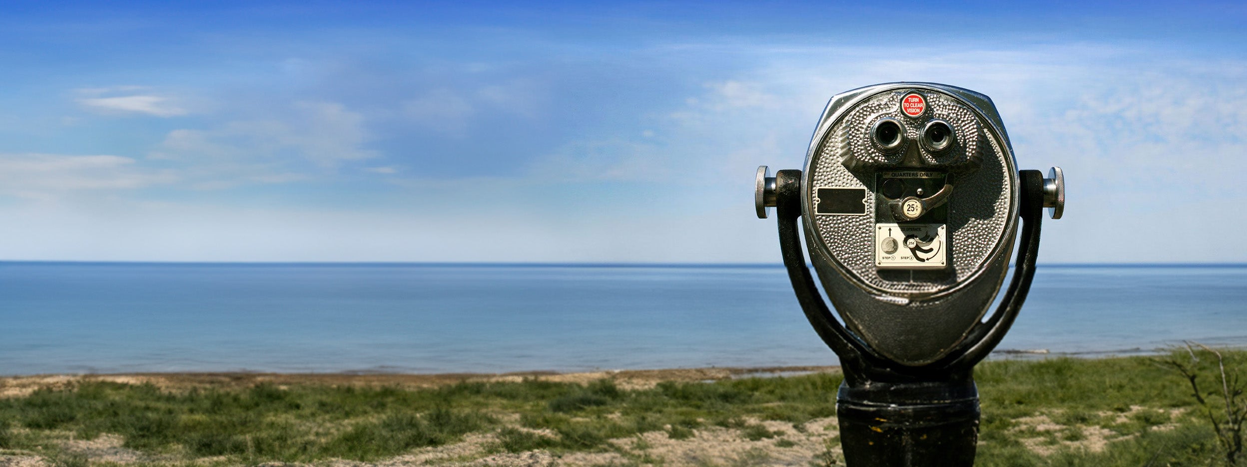 coin-operated binoculars overlooking landscape